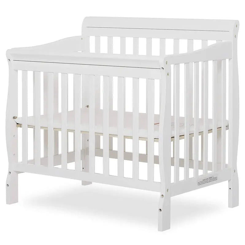 White Aden 4-in-1 Convertible Mini Crib for Small Spaces