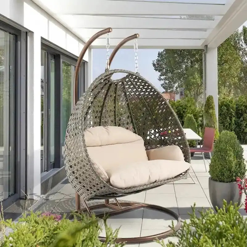 LeisureMod 2-Person Hanging Egg Chair  Indoor/Outdoor Rattan Wicker Swing with Stand and Cushioned Lounger